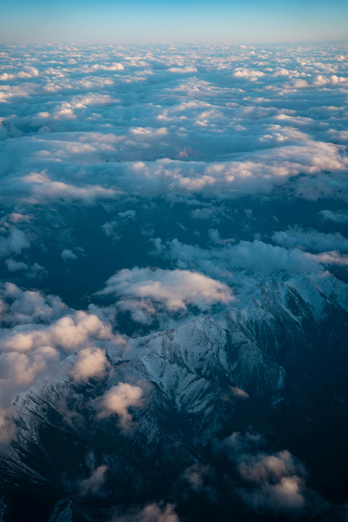 Above the Clouds: Majestic Aerial Mountain View Metal Poster